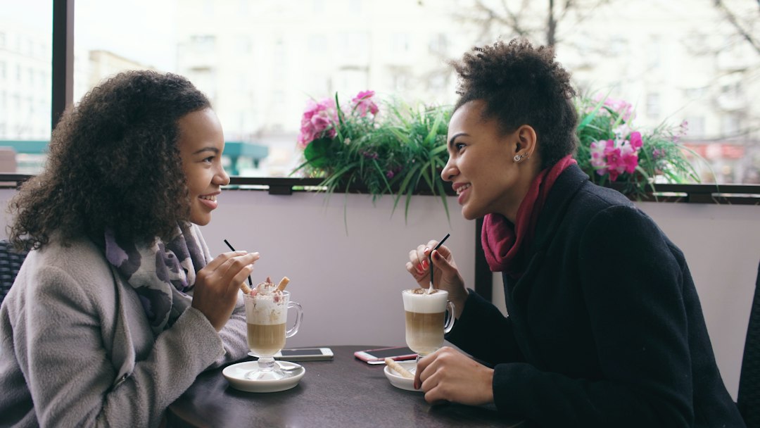 Two women in conversation over coffee
